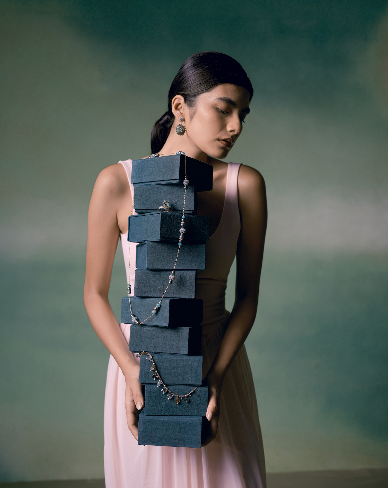 Women holding Moi fine Jewelry 