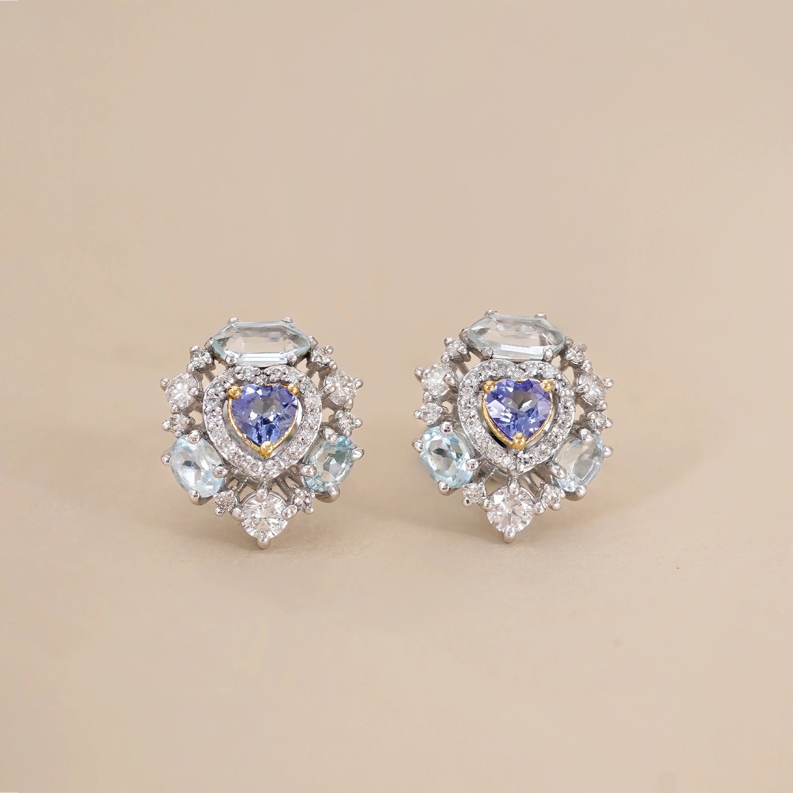 Amalfi Sky Studs with heart-shaped tanzanite surrounded by brilliant diamonds and blue topaz.