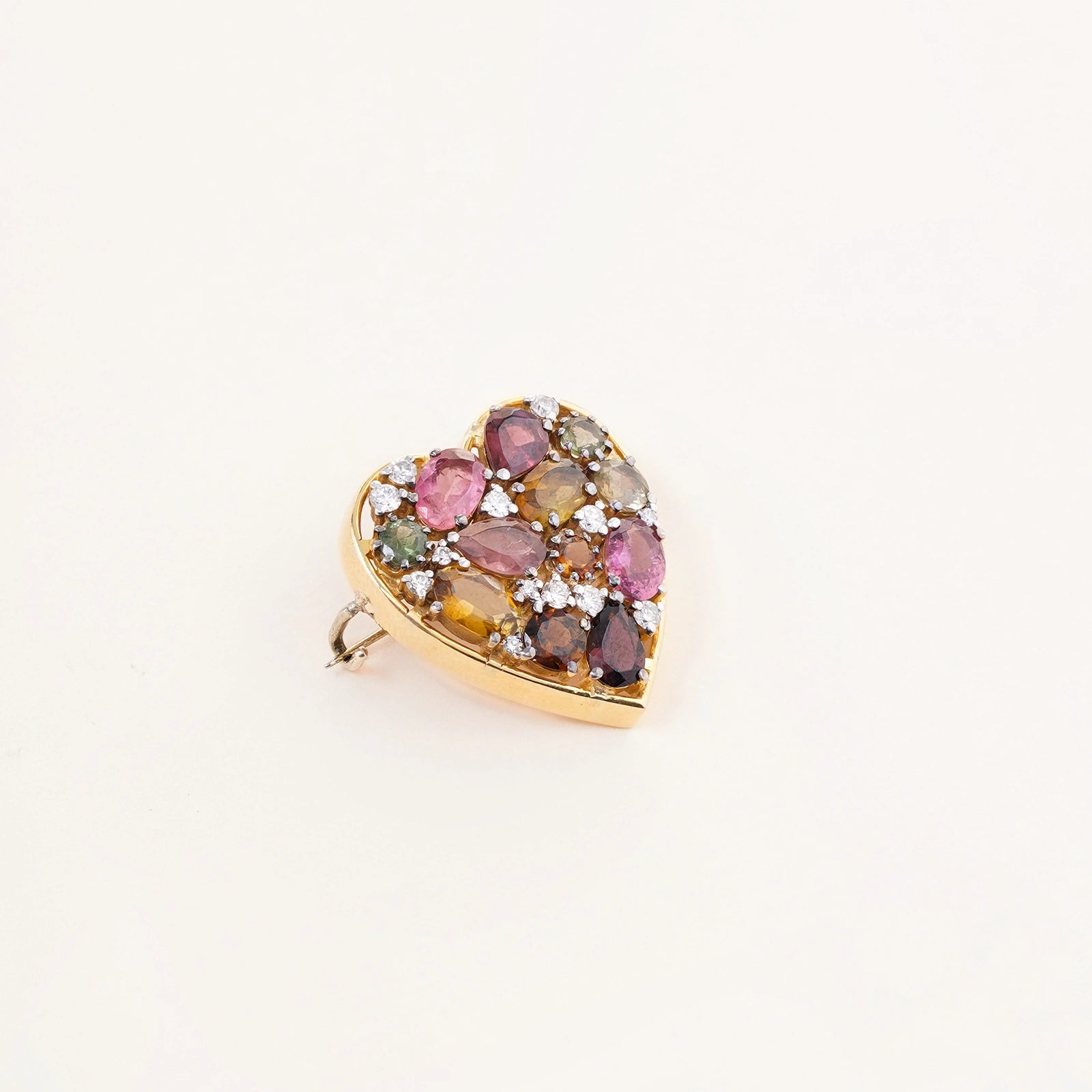 Bae Brooch with multi tourmaline cluster and brilliant cut diamond accents designed for lapel scarf or coat styling.