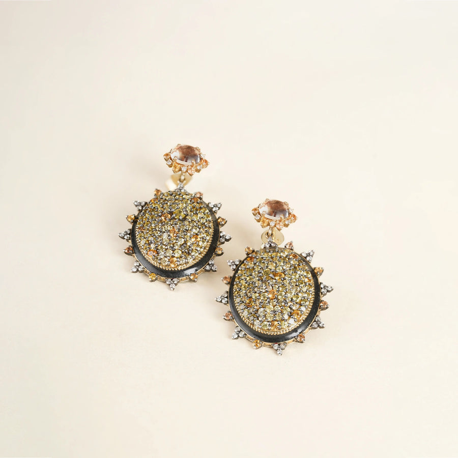 Sunburst earrings featuring pavé sapphires in warm, sun-kissed hues with faceted Green Amethyst stud tops.