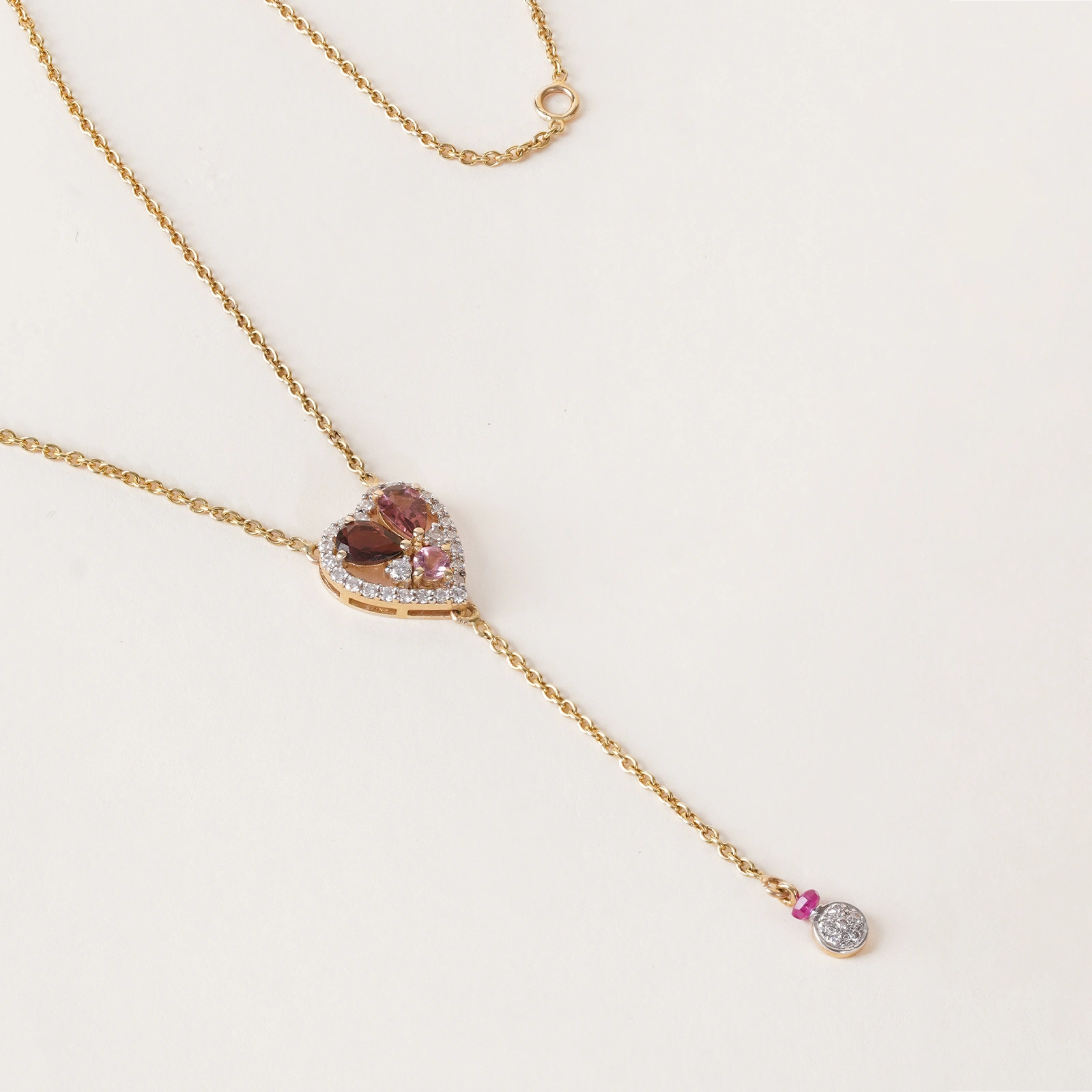 Cherie Necklace featuring heart-shaped diamond frame and pink tourmaline.