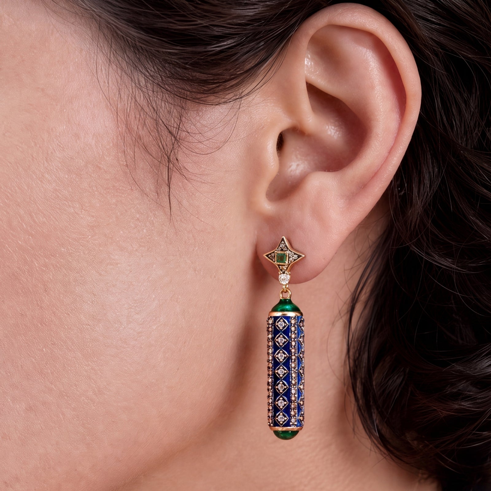 Close-up of a cabochon emerald set among natural rose-cut diamonds