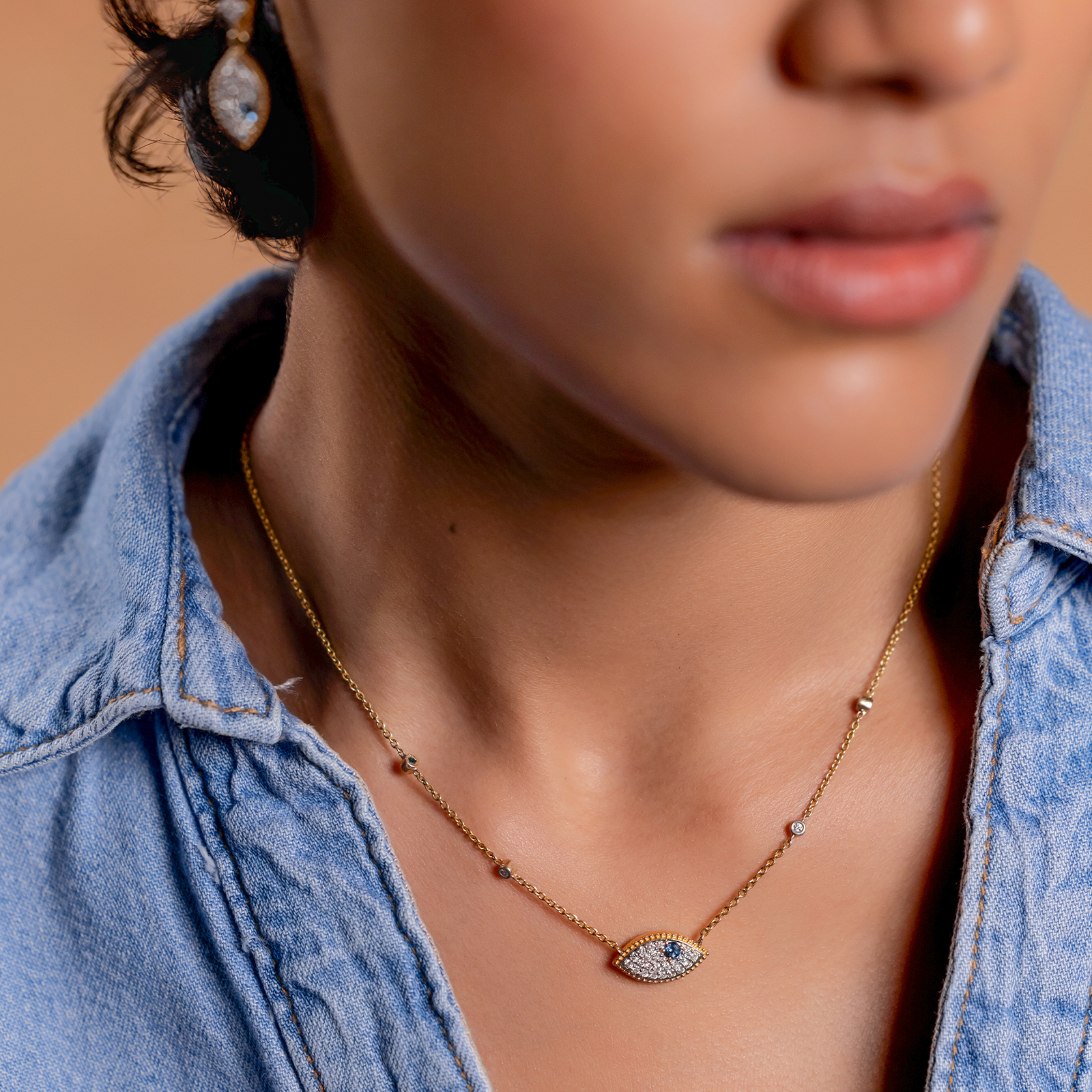 Evil Eye Necklace in 14K gold with blue topaz evil eye pendant and natural brilliant-cut diamonds