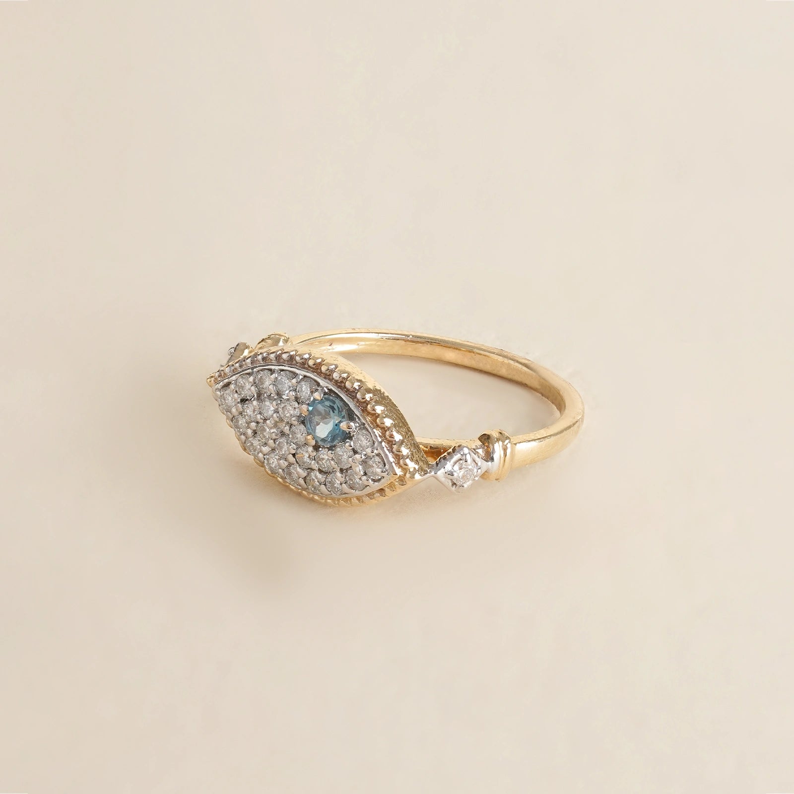 Evil Eye Ring in 14K gold with blue topaz evil eye and natural brilliant-cut diamonds