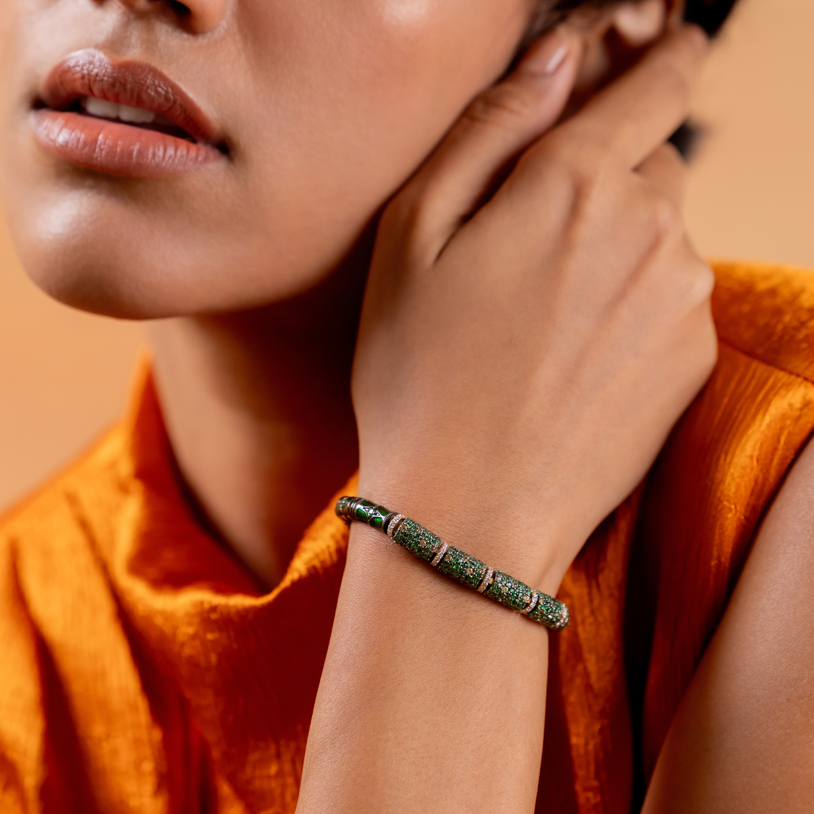 Evra Forest Bracelet in 14K gold and 925 silver with sapphire and tsavorite pavé half-barrel units, brilliant-cut diamond spacers, and green enamel back detail