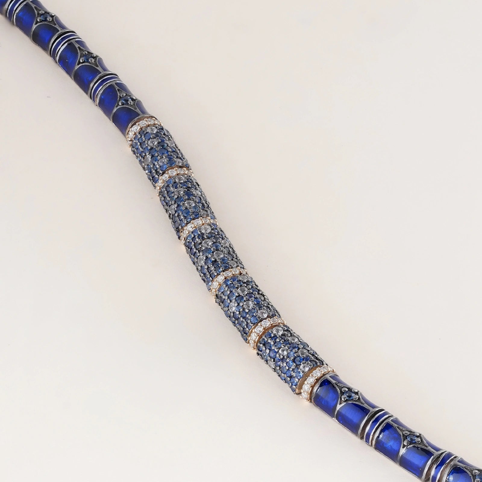 Evra Sky Bracelet in 14K gold and 925 silver with sapphire pavé half-barrel units, brilliant-cut diamond spacers, and blue enamel back detail