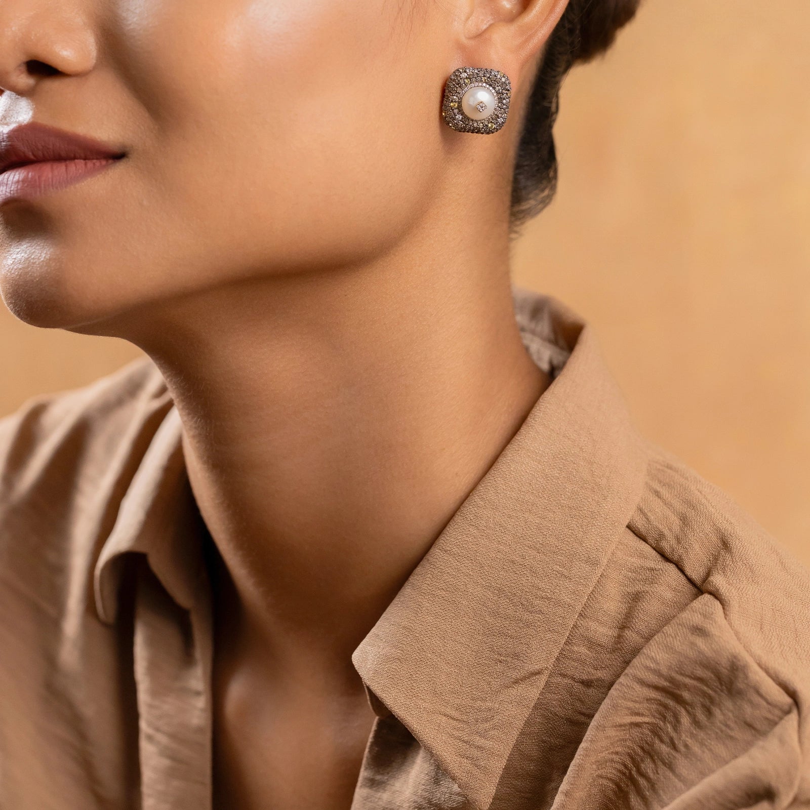 Gwen Ear Studs in 14K gold and 925 silver with cultured pearl centre, natural rose-cut diamonds, sapphires and black enamel