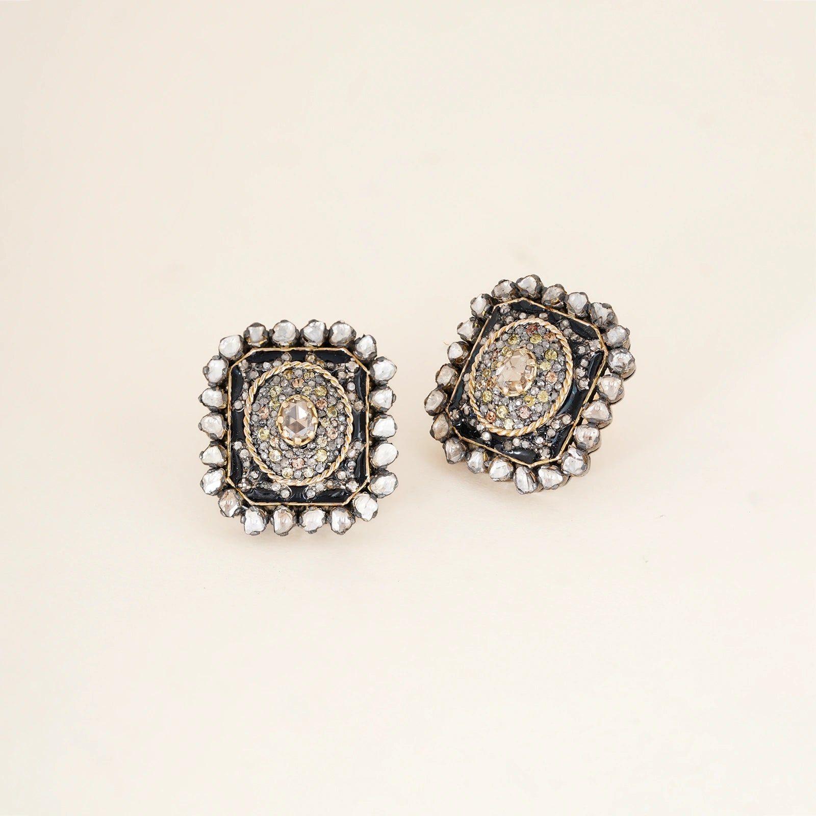 Jehan Ear Studs in gold and 925 silver with sapphire centre, rose-cut diamond frame, vilandi diamond halo and black enamel detail