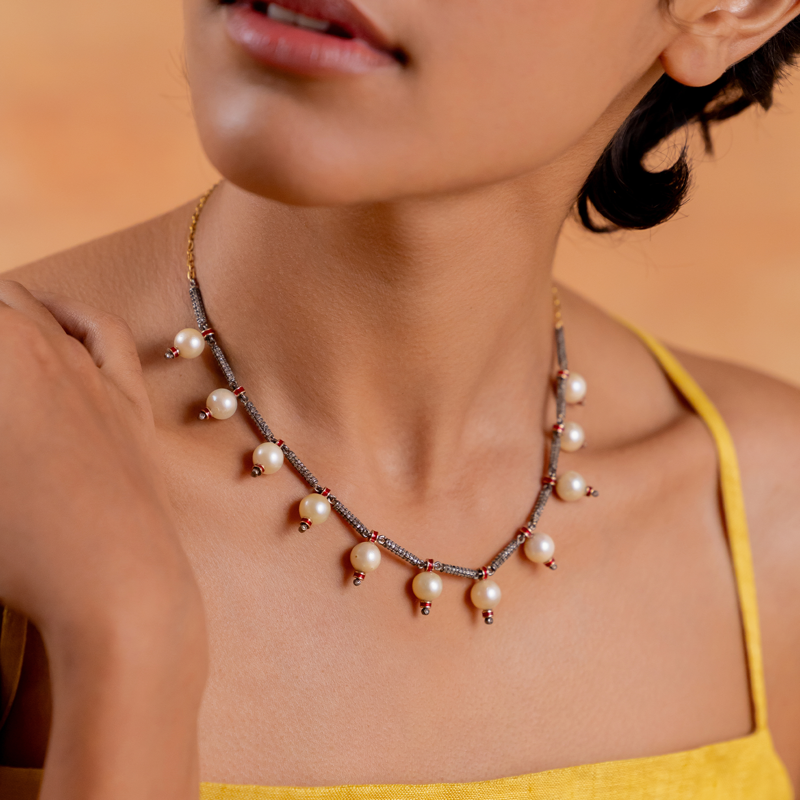 Jennie Snow Necklace with cultured pearls and natural rose-cut diamonds strung with intermittent red enamel details