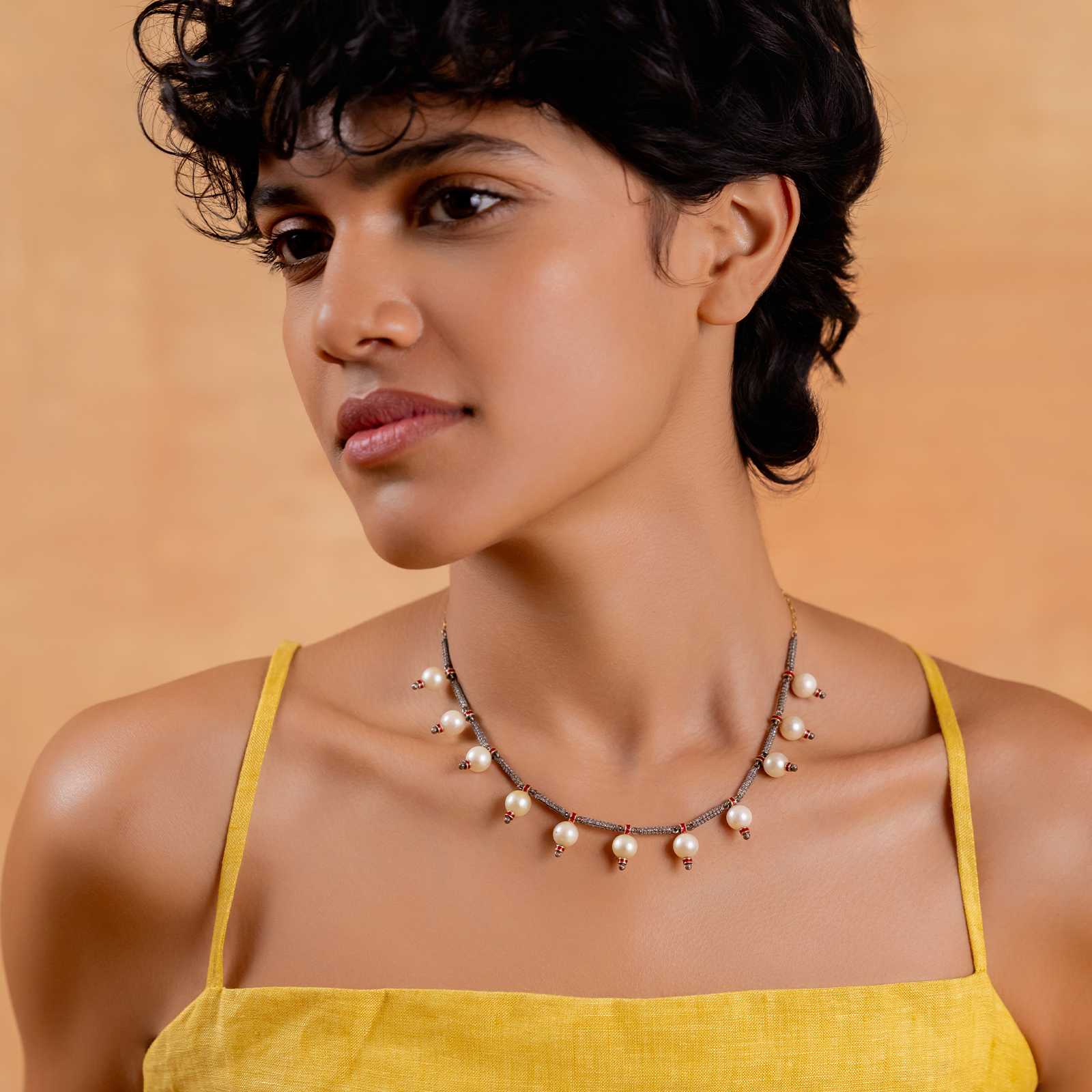 Jennie Snow Necklace with cultured pearls and natural rose-cut diamonds strung with intermittent red enamel details
