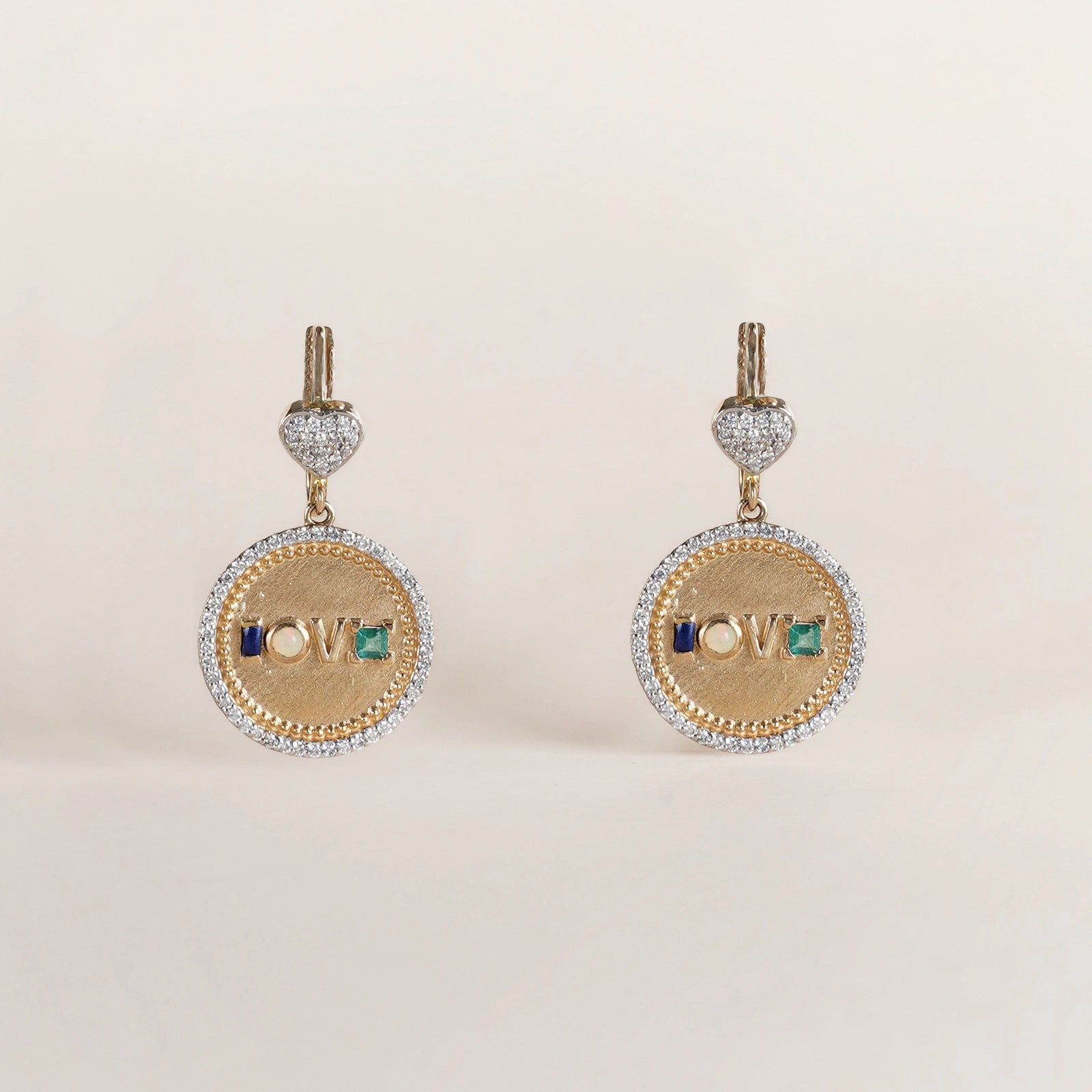 Fine 14K gold medallion earrings with diamond detailing and Victorian acrostic gemstone design.