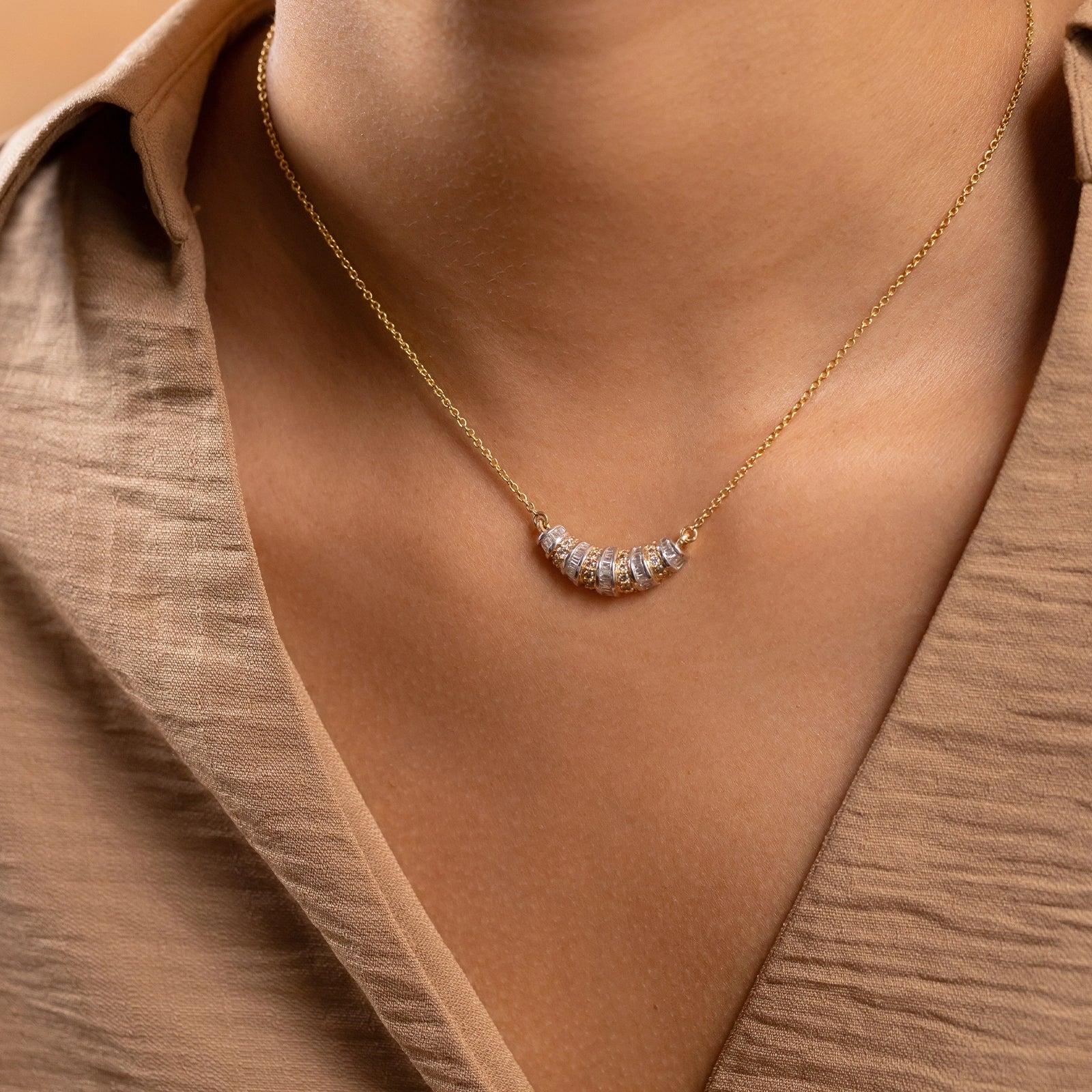Paris Mini Pendant Necklace in 14K gold with alternating natural champagne diamonds and baguette diamonds in an architectural setting