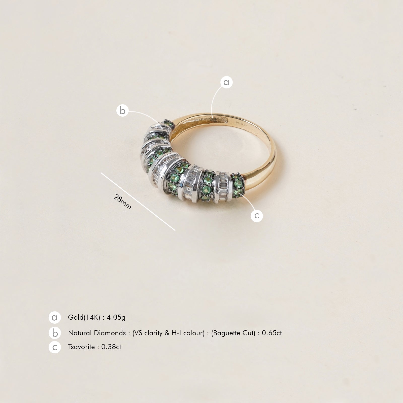 Paris Tsavorite Ring in 14K gold with alternating natural baguette diamonds and tsavorite in an architectural band