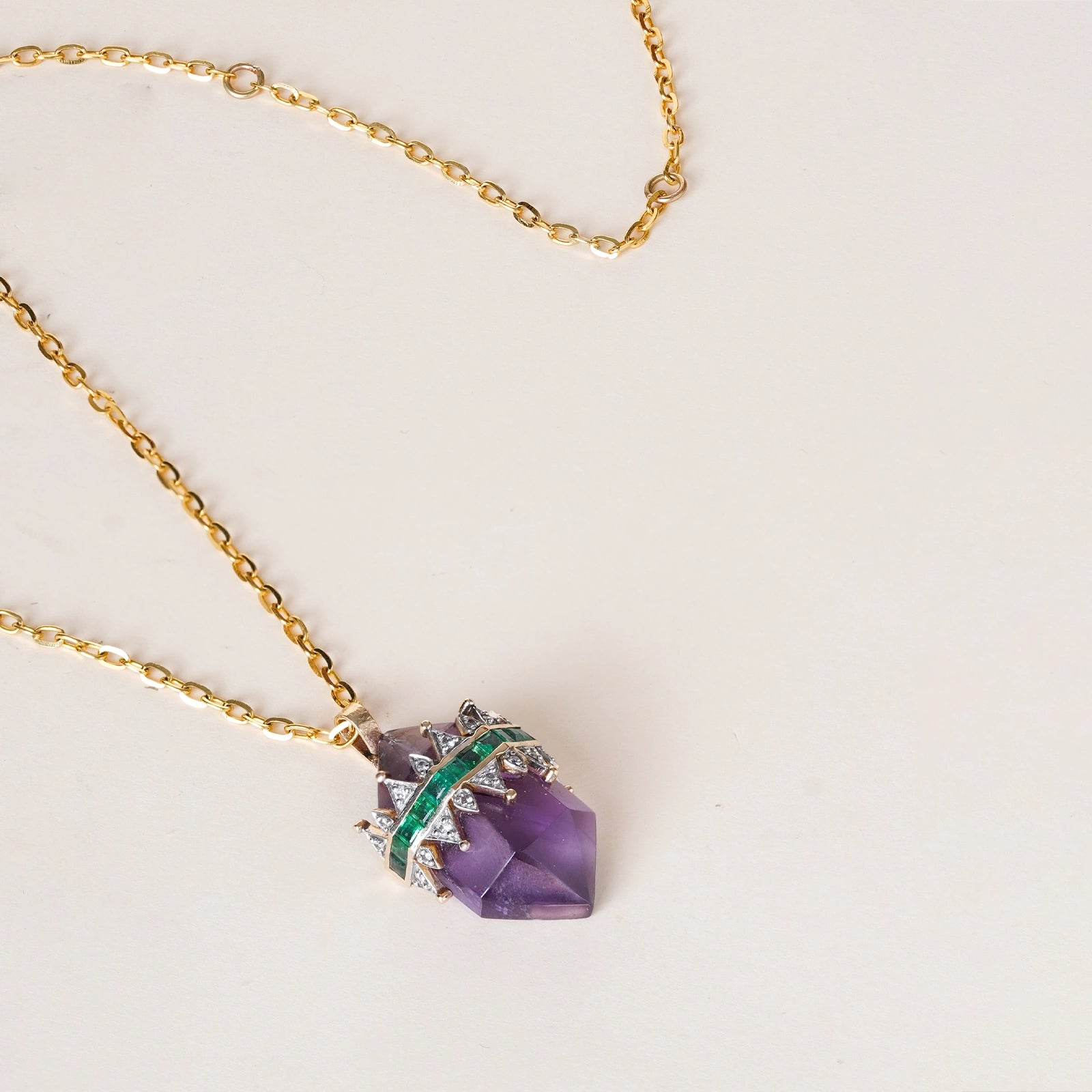 Promise Mini Pendant Necklace in yellow gold with crystal-cut purple amethyst crowned by a diamond and emerald tiara on an omega chain