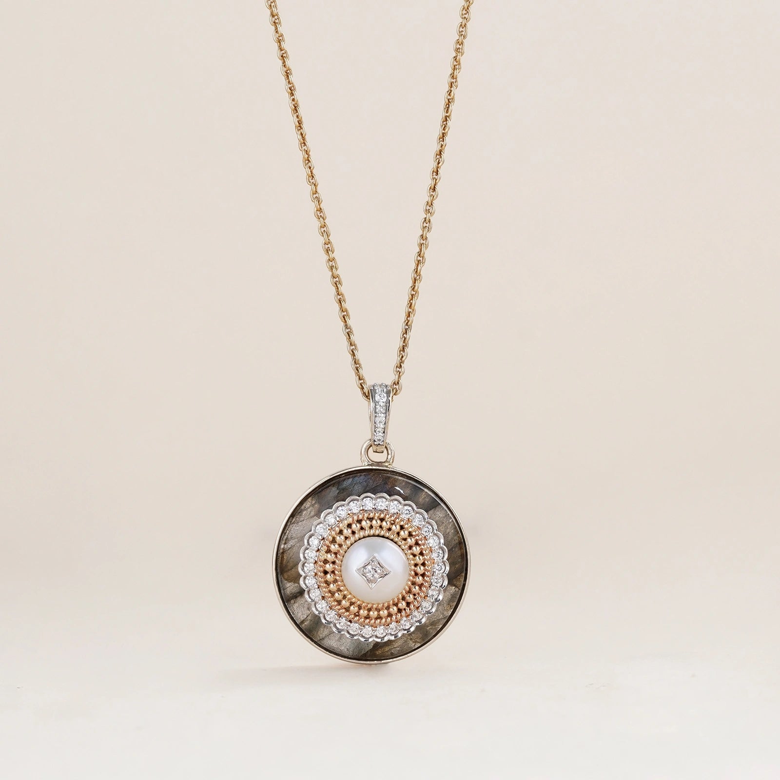 Rae Pendant Necklace in 14K gold with cultured pearl and natural brilliant-cut diamonds on a labradorite base with textured gold detail