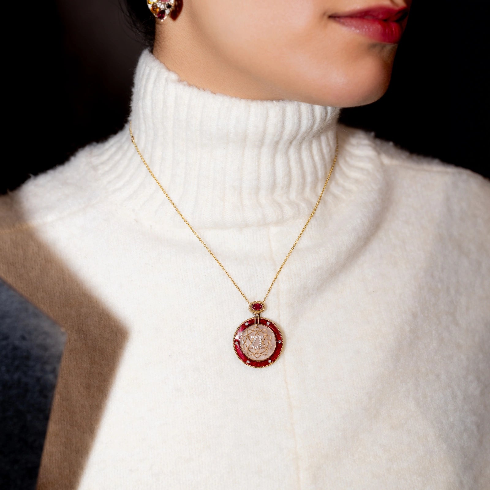 Anah Rose Pendant Necklace in 14K gold featuring rose quartz, diamond Anahata motif and red enamel.