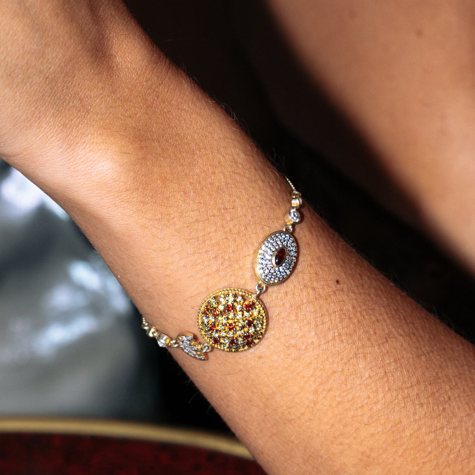 Close-up of yellow and white sapphires set in micropave along the bracelet