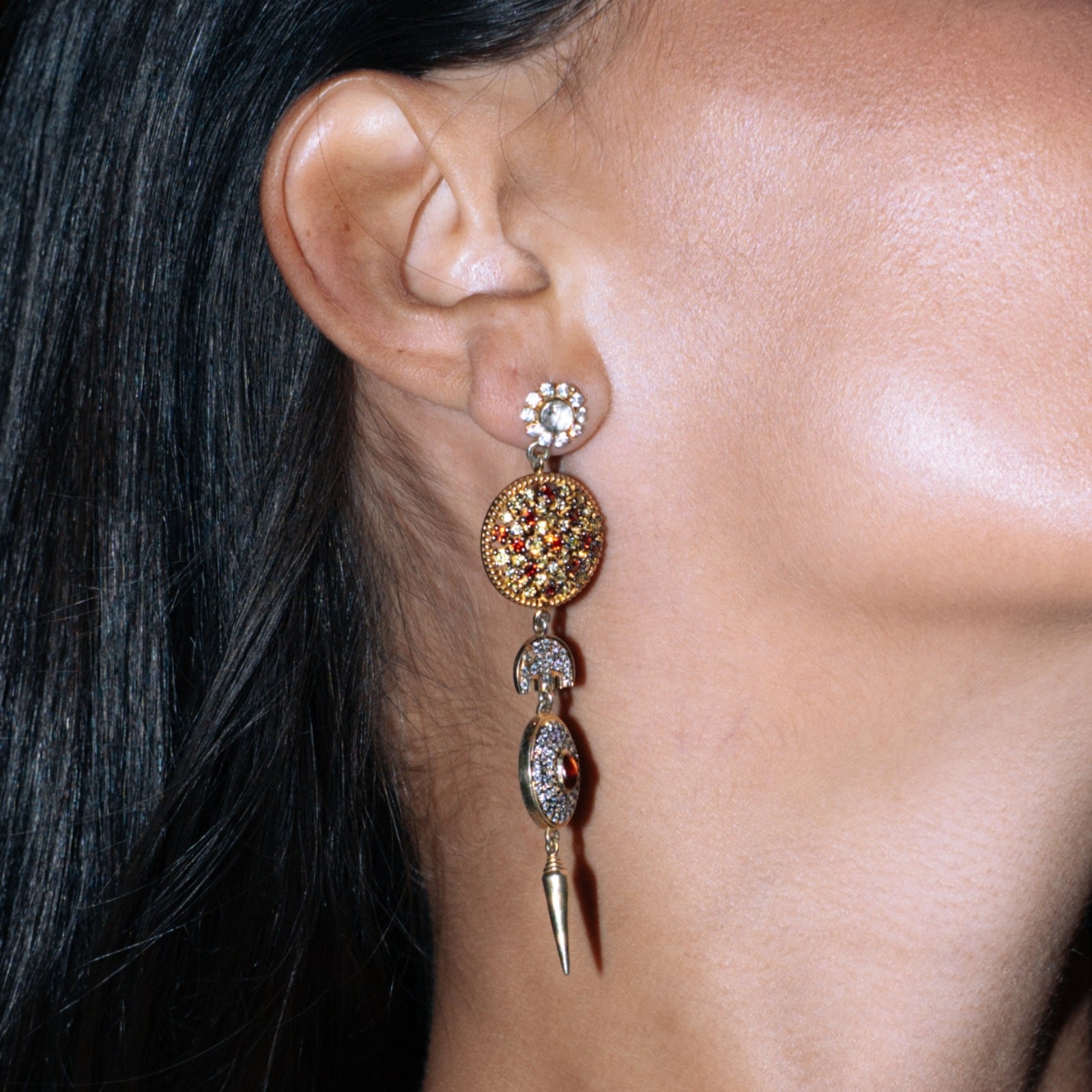 Close-up of the pave sunburst of yellow and white sapphires